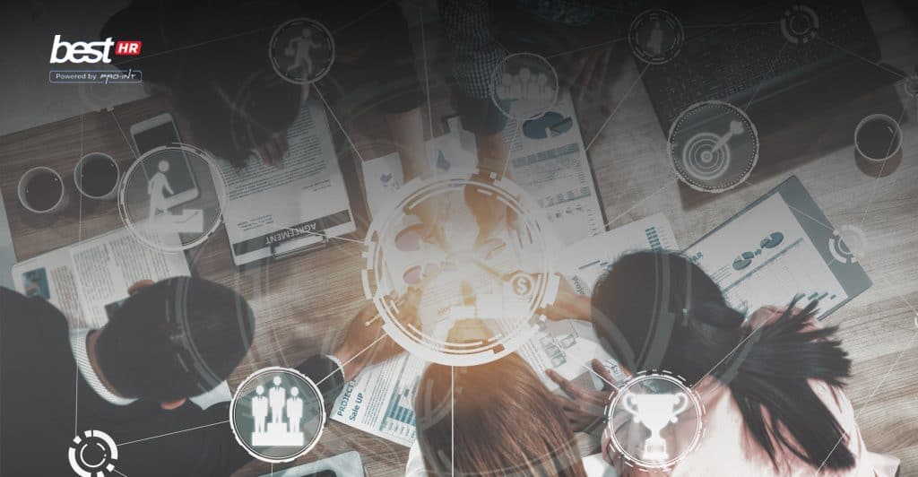 Advanced business team collaborating with digital interfaces for project management and data analysis at a workspace in Indonesia