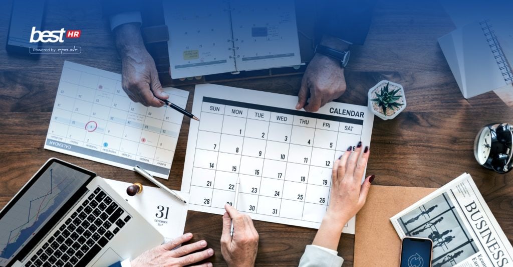 An ALT tag describing a work schedule planning scene with calendars notebooks and a laptop illustrating the concept of shift work scheduling and management