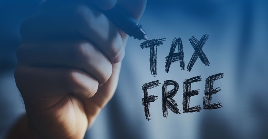 Handwriting Tax Free on glass with a marker symbolizing tax exemption for employees earning up to Rp10 juta in Indonesia starting 2026
